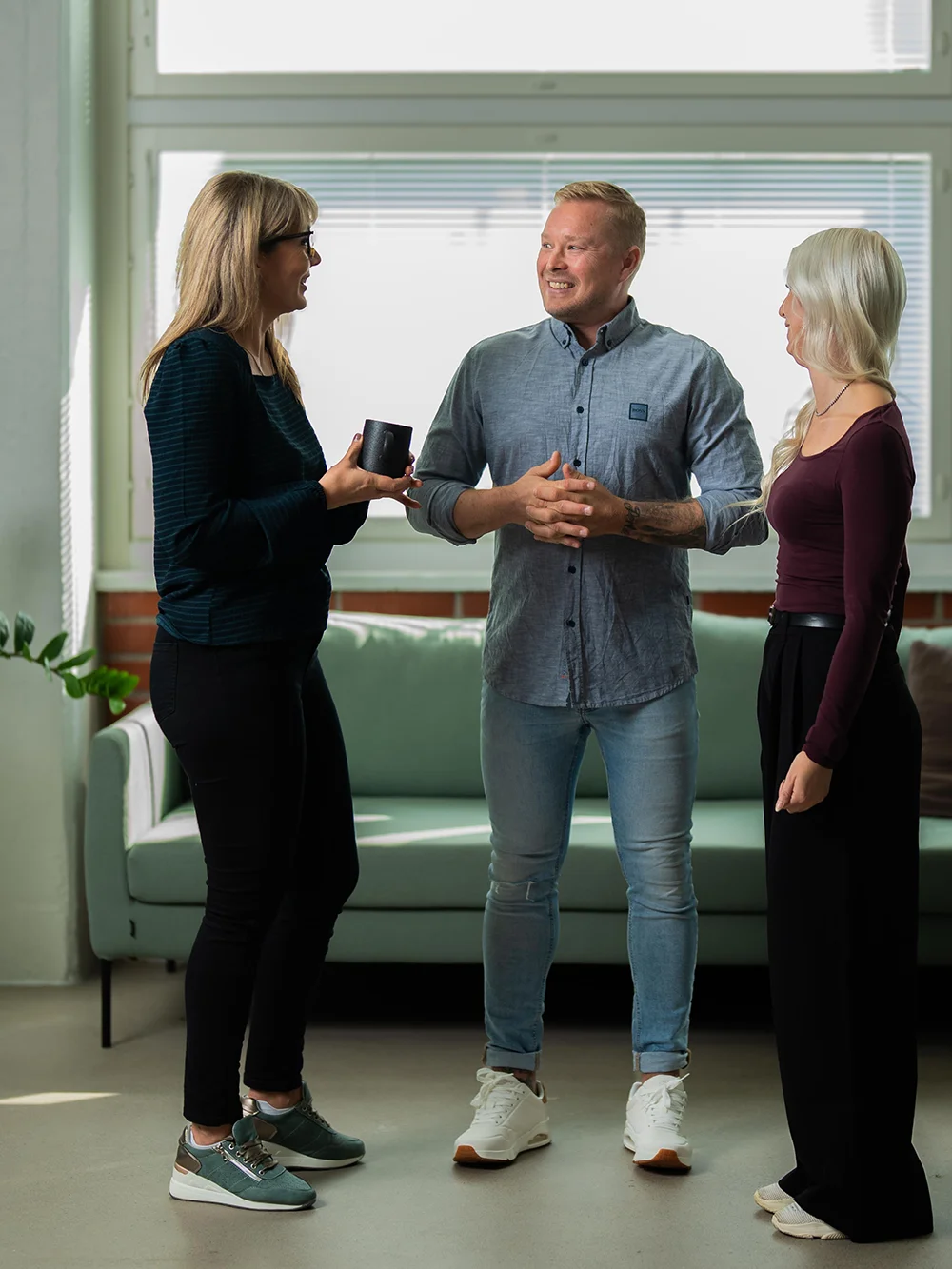 Three people having a conversation