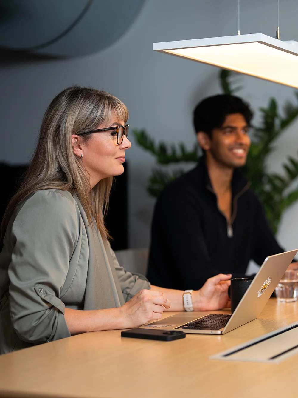 Two people attenting a meeting