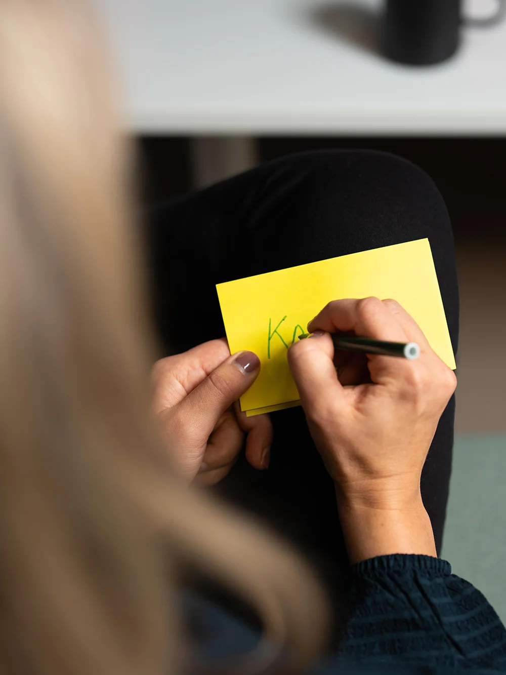 Writing on a sticky note